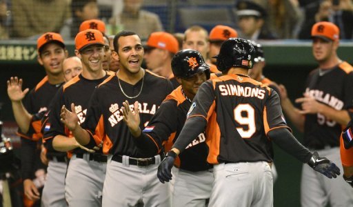 Dutch infielder Andrelton Simmons (no. 9) is congratulated by his teammates during their WBC game on March 12, 2013 Dutch infielder Andrelton Simmons (no. 9) is congratulated by his teammates during their WBC game on March 12, 2013