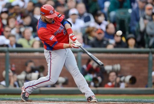 Mike Aviles of Puerto Rico hits an RBI single during their World Baseball Classic game against Japan on March 17, 2013 Mike Aviles of Puerto Rico hits an RBI single during their World Baseball Classic game against Japan on March 17, 2013