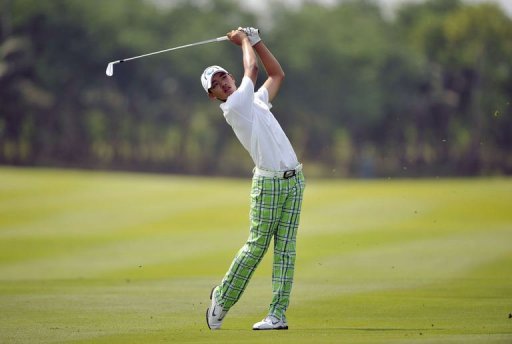 Guan Tianlang hits a shot at the Amata Spring Country Club in Chonburi, on November 3, 2012 Guan Tianlang hits a shot at the Amata Spring Country Club in Chonburi, on November 3, 2012