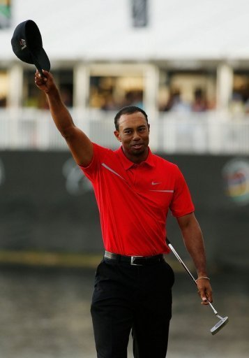 Tiger Woods celebrates victory in Doral, Florida on March 10, 2013 Tiger Woods celebrates victory in Doral, Florida on March 10, 2013