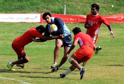 A Lahore player tries to ride the tackles of the Army team, on February 24, 2013 A Lahore player tries to ride the tackles of the Army team, on February 24, 2013