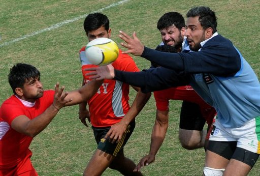 Players battle for the ball in a match between Lahore and the Army on February 24, 2013 Players battle for the ball in a match between Lahore and the Army on February 24, 2013