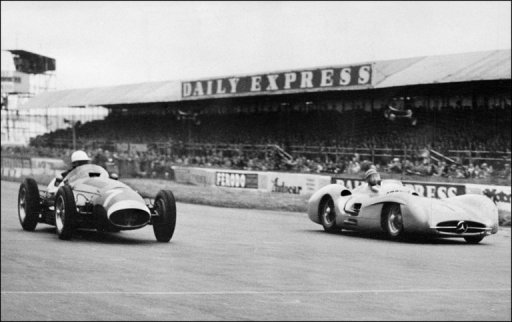 Picture taken in 1954 at Silverstone shows Juan Manuel Fangio (R) in a Mercedes competing with Stirling Moss Picture taken in 1954 at Silverstone shows Juan Manuel Fangio (R) in a Mercedes competing with Stirling Moss