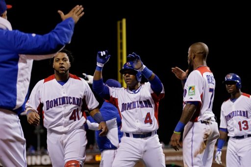 Miguel Tejada (C) celebrates with Carlos Santana (L) and Jose Reyes after scoring in the fifth inning on March 18, 2013 Miguel Tejada (C) celebrates with Carlos Santana (L) and Jose Reyes after scoring in the fifth inning on March 18, 2013