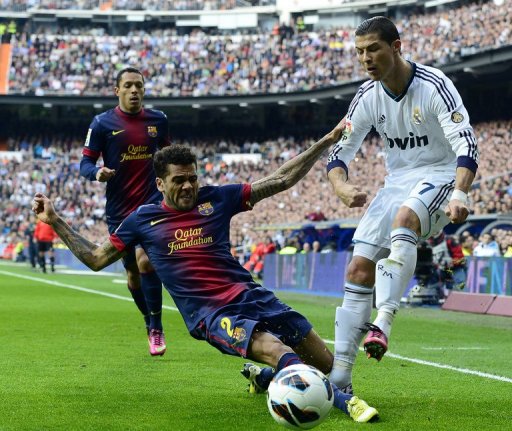 Real Madrid's Cristiano Ronaldo clashes with Barcelona's Dani Alves in Madrid on March 2, 2013 Real Madrid's Cristiano Ronaldo clashes with Barcelona's Dani Alves in Madrid on March 2, 2013