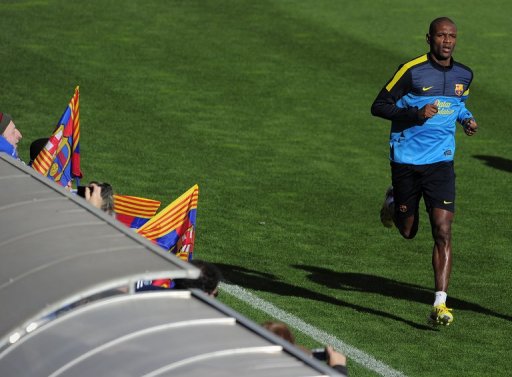Eric Abidal takes part in an open training session at the Mini Stadium in Barcelona on January 4, 2013 Eric Abidal takes part in an open training session at the Mini Stadium in Barcelona on January 4, 2013