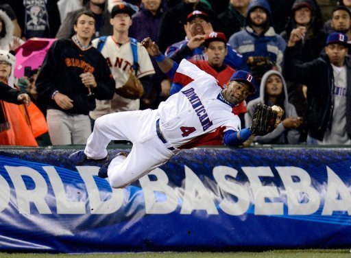 Miguel Tejada of the Dominican Republic dives to make a catch at the World Baseball Classic on March 19, 2013 Miguel Tejada of the Dominican Republic dives to make a catch at the World Baseball Classic on March 19, 2013