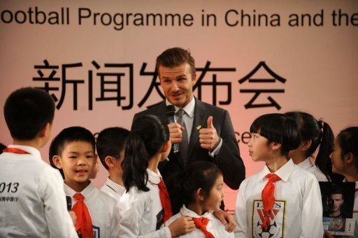 David Beckham (C) answers questions from a group of pupils at a primary school in Beijing on March 20 David Beckham (C) answers questions from a group of pupils at a primary school in Beijing on March 20