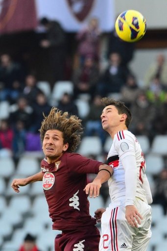 AC Milan defender Mattia De Sciglio (R) goes up for the ball with Torino midfielder Alessio Cerci on December 9, 2012 AC Milan defender Mattia De Sciglio (R) goes up for the ball with Torino midfielder Alessio Cerci on December 9, 2012