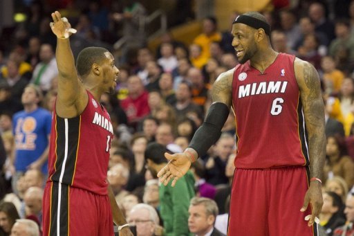 Mario Chalmers (L) and LeBron James discuss a play against the Cleveland Cavaliers on March 20, 2013 Mario Chalmers (L) and LeBron James discuss a play against the Cleveland Cavaliers on March 20, 2013