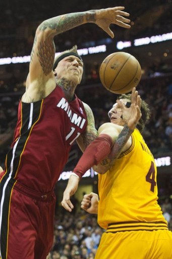 Chris Andersen (L) of the Miami Heat is fouled by Luke Walton on March 20, 2013 Chris Andersen (L) of the Miami Heat is fouled by Luke Walton on March 20, 2013