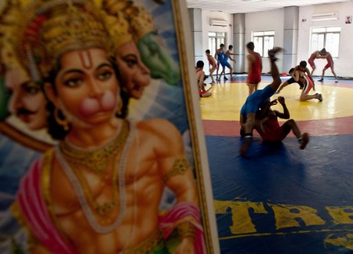 Young Indian wrestlers train next to a picture of Hindu monkey-god Lord Hanuman, in New Delhi, on March 4, 2013 Young Indian wrestlers train next to a picture of Hindu monkey-god Lord Hanuman, in New Delhi, on March 4, 2013
