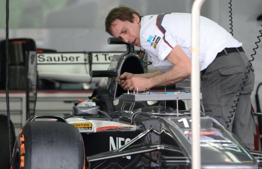 A crew member prepares Nico Hulkenberg's car ahead for the Formula One Malaysian Grand Prix at Sepang on March 21, 2013 A crew member prepares Nico Hulkenberg's car ahead for the Formula One Malaysian Grand Prix at Sepang on March 21, 2013