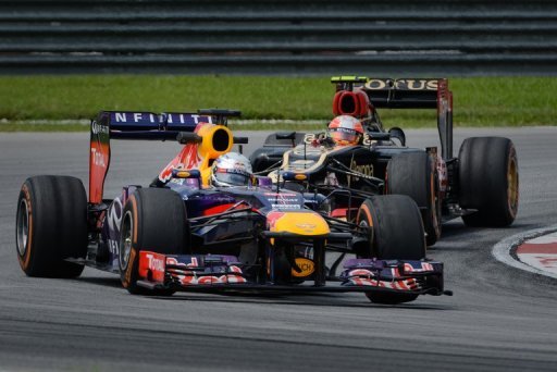 Sebastian Vettel (front) and Romain Grosjean drive in Sepang on March 22, 2013 in practice for the Malaysian Grand Prix Sebastian Vettel (front) and Romain Grosjean drive in Sepang on March 22, 2013 in practice for the Malaysian Grand Prix