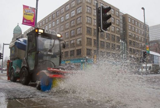 A road sweeper tries to clear snow from the pavements in Belfast City centre in Northern Ireland, on March 22, 2013 A road sweeper tries to clear snow from the pavements in Belfast City centre in Northern Ireland, on March 22, 2013