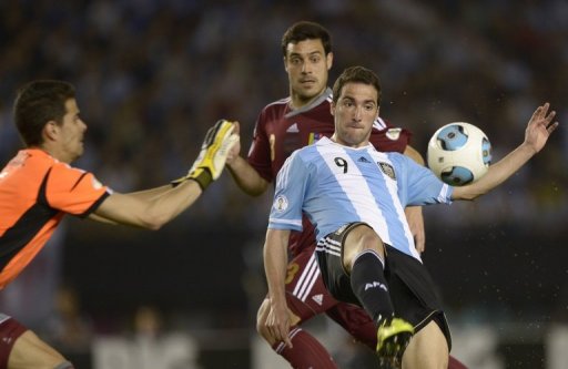 Argentina's Gonzalo Higuain (R) scored twice against Venezuela, in Buenos Aires, on March 22, 2013 Argentina's Gonzalo Higuain (R) scored twice against Venezuela, in Buenos Aires, on March 22, 2013