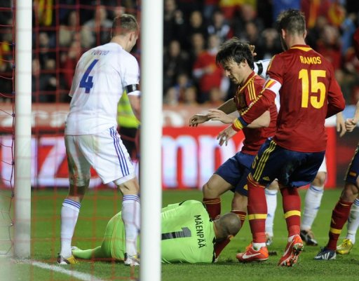 Spain's David Silva is blocked by Finland goalkeeper Niki Maenpaa in their FIFA 2014 World Cup qualifier March 22, 2013 Spain's David Silva is blocked by Finland goalkeeper Niki Maenpaa in their FIFA 2014 World Cup qualifier March 22, 2013