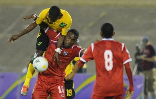 Jamaica's Demar Phillips (top) fouls Panama's Alex Rodriguez at the National Stadium March 22, 2013, in Kingston Jamaica's Demar Phillips (top) fouls Panama's Alex Rodriguez at the National Stadium March 22, 2013, in Kingston