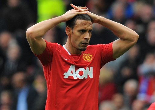 Manchester United defender Rio Ferdinand reacts at Old Trafford in Manchester, north-west England on April 22, 2012 Manchester United defender Rio Ferdinand reacts at Old Trafford in Manchester, north-west England on April 22, 2012