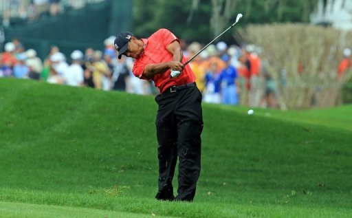 Tiger Woods plays his second shot at the par 4, 1st hole on March 24, 2013 in Orlando, Florida Tiger Woods plays his second shot at the par 4, 1st hole on March 24, 2013 in Orlando, Florida