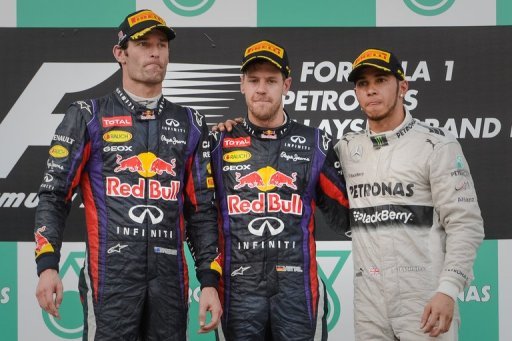 Sebastian Vettel (C) at the podium with second-placed Mark Webber (L) and third-placed Lewis Hamilton on March 24, 2013 Sebastian Vettel (C) at the podium with second-placed Mark Webber (L) and third-placed Lewis Hamilton on March 24, 2013