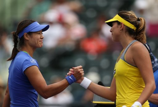 Li Na (L) shakes hands at the net after her victory against Garbine Muguruza on March 25, 2013 in Key Biscayne Li Na (L) shakes hands at the net after her victory against Garbine Muguruza on March 25, 2013 in Key Biscayne