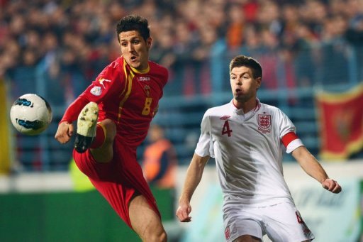 Montenegro forward Stevan Jovetic (L) shields the ball from Steven Gerrard on March 26, 2013 Montenegro forward Stevan Jovetic (L) shields the ball from Steven Gerrard on March 26, 2013