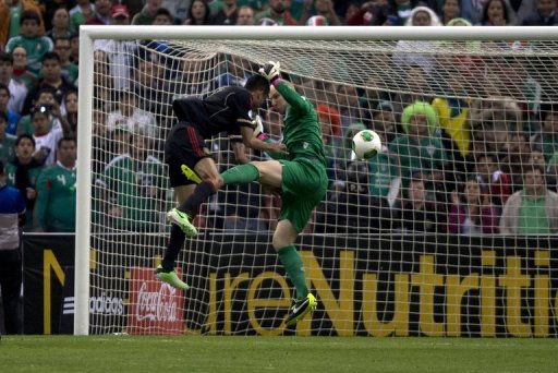 Mexico's Jesus Zavala (L) is denied by USA goalkeeper Brad Guzan during the World Cup qualifier on March 26, 2013 Mexico's Jesus Zavala (L) is denied by USA goalkeeper Brad Guzan during the World Cup qualifier on March 26, 2013