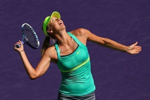 Maria Sharapova hits a smash against Sara Errani at the Miami Masters on March 27, 2013 Maria Sharapova hits a smash against Sara Errani at the Miami Masters on March 27, 2013