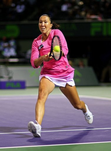 Jelena Jankovic of Serbia plays a backhand to Roberta Vinci at the Miami Masters on March 27, 2013 Jelena Jankovic of Serbia plays a backhand to Roberta Vinci at the Miami Masters on March 27, 2013