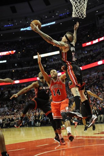 Chris Andersen (R) of the Miami Heat blocks a shot by Daequan Cook of the Chicago Bulls on March 27, 2013 Chris Andersen (R) of the Miami Heat blocks a shot by Daequan Cook of the Chicago Bulls on March 27, 2013