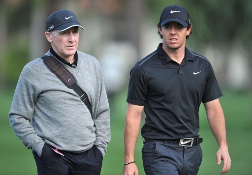 Rory McIlroy (R) talks with his coach Michael Bannon at PGA National in Palm Beach Gardens on February 27, 2013 Rory McIlroy (R) talks with his coach Michael Bannon at PGA National in Palm Beach Gardens on February 27, 2013