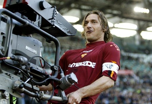 Francesco Totti celebrates with a TV camera after scoring at Rome's Olympic stadium on April 21, 2004 Francesco Totti celebrates with a TV camera after scoring at Rome's Olympic stadium on April 21, 2004
