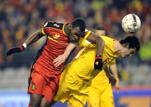 Belgium forward Christian Benteke (L) goes up for a header with Macedonia's Vance Sikov on March 26, 2013 Belgium forward Christian Benteke (L) goes up for a header with Macedonia's Vance Sikov on March 26, 2013