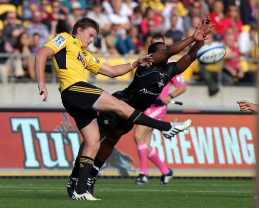 Beauden Barrett (L) of the Wellington Hurricanes kicks the ball away, on March 30, 2013 Beauden Barrett (L) of the Wellington Hurricanes kicks the ball away, on March 30, 2013
