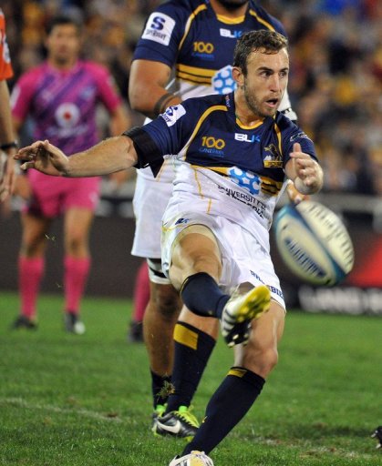 Nic White of the Brumbies kicks the ball during a match against the Northern Bulls, in Canberra, on March 30, 2013 Nic White of the Brumbies kicks the ball during a match against the Northern Bulls, in Canberra, on March 30, 2013