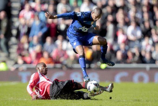 Sunderland's Titus Bramble (left) vies with Manchester United's Ashley Young in Sunderland on March 30, 2013 Sunderland's Titus Bramble (left) vies with Manchester United's Ashley Young in Sunderland on March 30, 2013