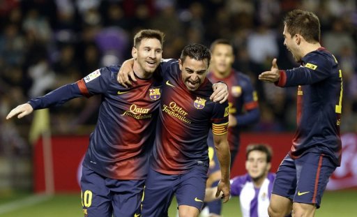 Barcelona's Xavi Hernandez (centre) celebrates with Lionel Messi after scoring against Valladolid on December 22, 2012 Barcelona's Xavi Hernandez (centre) celebrates with Lionel Messi after scoring against Valladolid on December 22, 2012