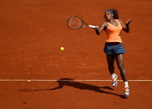Serena Williams returns the ball to Anabel Medina during their match at the Madrid Masters in Madrid on May 10, 2013 Serena Williams returns the ball to Anabel Medina during their match at the Madrid Masters in Madrid on May 10, 2013