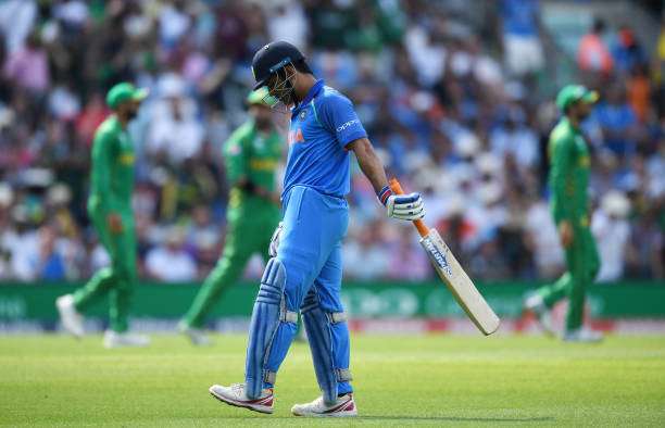 dhoni-of-india-leaves-the-field-after-being-caught-out-by-imad-wasim-picture-id697268962-800.jpg